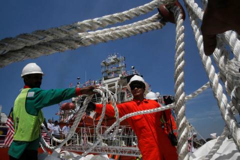 Crew members load supplies on a Malaysian ship, carrying aid for Rohingya, to set sail for Myanmar in Port Klang, Malaysia, February 3, 2017. PHOTO BY REUTERS/Joshua Paul