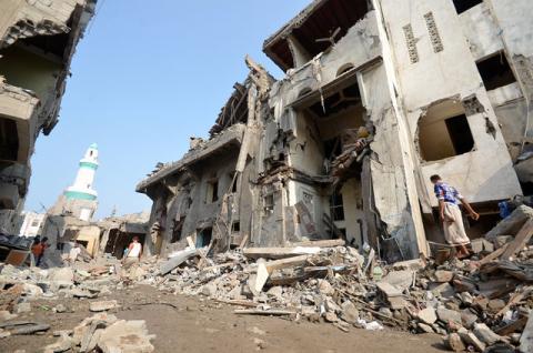 A man walks on the rubble of houses at the site of a Saudi-led air strike in the Red Sea port city of Hodeidah, Yemen, September 22, 2016. PHOTO BY REUTERS/Abduljabbar Zeyad