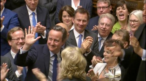 Britain's outgoing Prime Minister, David Cameron (2nd L), is applauded after Prime Minister's Questions in the House of Commons, in central London, Britain in this still image taken from video July 13, 2016. PHOTO BY REUTERS