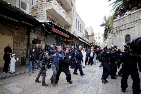 Israeli security personnel push a photojournalist in Jerusalem's old city during a demonstration as Palestinians call for a "Day of Rage" in response to U.S. President Donald Trump's recognition of Jerusalem as Israel's capital, December 22, 2017. PHOTO BY REUTERS/Ammar Awad