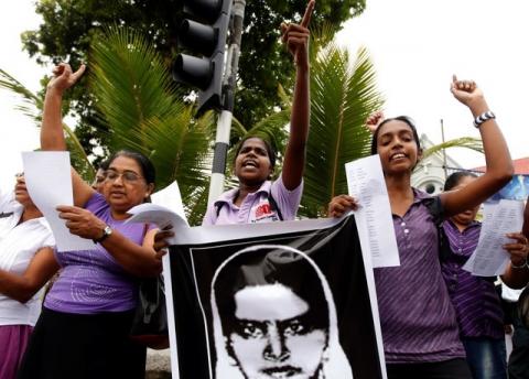Demonstrators hold up an image of Rizana Nafeek as they shout slogans during a protest against her execution, in Colombo, January 11, 2013. PHOTO BY REUTERS/Dinuka Liyanawatte