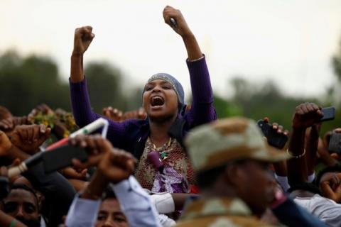 Demonstrators chant slogans while flashing the Oromo protest gesture during Irreecha, the thanksgiving festival of the Oromo people, in Bishoftu town, Oromia region, Ethiopia, October 2, 2016. PHOTO BY REUTERS/Tiksa Negeri