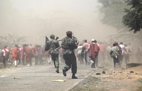 Riot policemen disperse demonstrators during protests to oust Narok county Governor Samuel Tunai in Narok, Kenya, January 26, 2015. PHOTO BY REUTERS/Thomas Mukoya