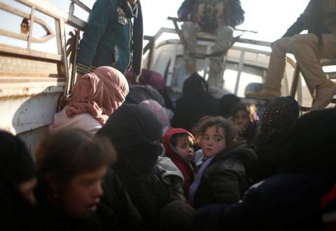 Displaced Iraqis, fleeing villages under Islamic State control, sit in a van as security forces backed by tribal militias battle to retake area on the eastern bank of the river Tigris, Iraq, December 7, 2016. PHOTO BY REUTERS/Mohammed Salem
