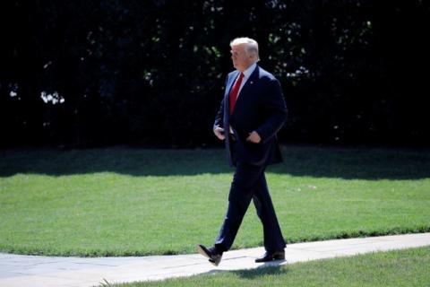 U.S. President Donald Trump leaves the Oval Office as he departs for vacation in Bedminster, New Jersey, from the South Lawn of the White House in Washington, U.S., August 4, 2017. PHOTO BY REUTERS/Carlos Barria
