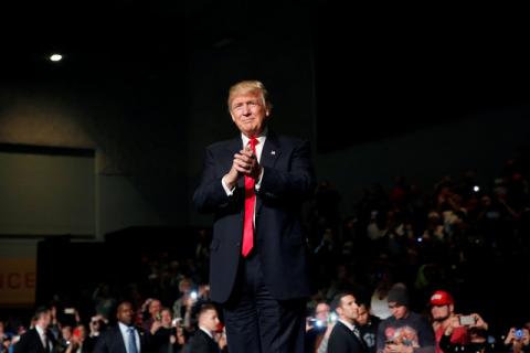 U.S. President-elect Donald Trump claps at the USA Thank You Tour event at the Iowa Events Center in Des Moines, Iowa, U.S., December 8, 2016. PHOTO BY REUTERS/Shannon Stapleton