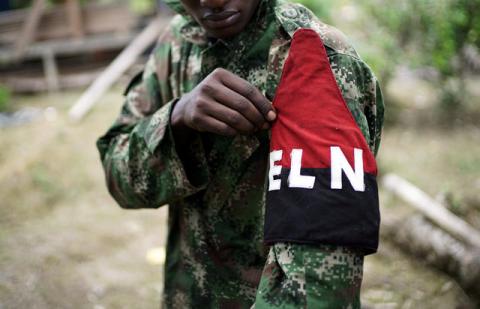 A rebel of Colombia's Marxist National Liberation Army (ELN) shows his armband while posing for a photograph, in the northwestern jungles, Colombia, August 31, 2017. PHOTO BY REUTERS/Federico Rios