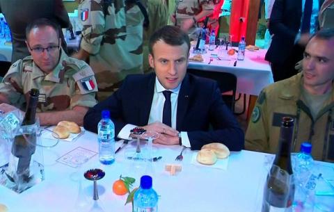 French President Emmanuel Macron, seen in this still image taken from video, sits with French military forces during a visit with troops who participate in the Operation Barkhane in Niamey, Niger, late December 22, 2017. PHOTO BY REUTERS