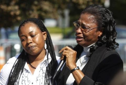Plaintiff Esther Kiobel (R) speaks during a protest against Royal Dutch Shell Petroleum in front of the U.S. Supreme Court in Washington, October 1, 2012. PHOTO BY REUTERS/Gary Cameron