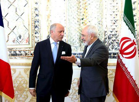French foreign minister Laurent Fabius (L) and his Iranian counterpart Mohammad Javad Zarif arrive for a meeting in Tehran, July 29, 2015. PHOTO BY REUTERS/Raheb Homavandi