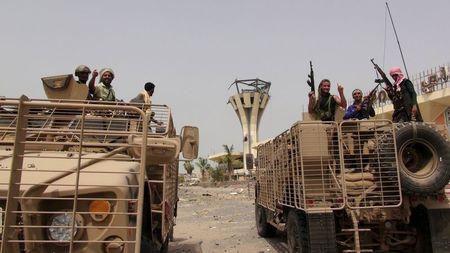 Southern Resistance fighters ride armoured personnel carriers at the international airport of Yemen's southern port city of Aden, July 14, 2015. PHOTO BY REUTERS/Stringer