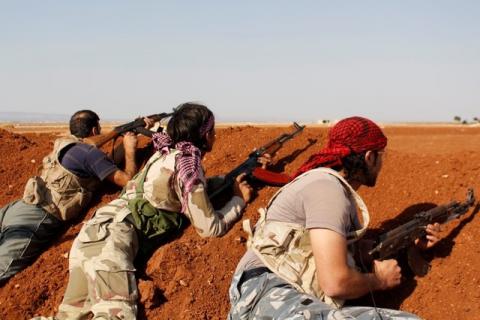 Rebel fighters take positions at the frontline during what they said were clashes with Islamic State militants in the town of Marea in Aleppo's countryside, October 3, 2014. PHOTO BY REUTERS/Rami Zayat