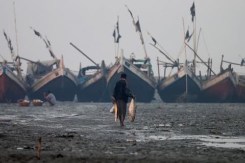 A Rohingya fisherman walks on the beach in Sittwe in the state of Rakhine, Myanmar, March 2, 2017. PHOTO BY REUTERS/Soe Zeya Tun