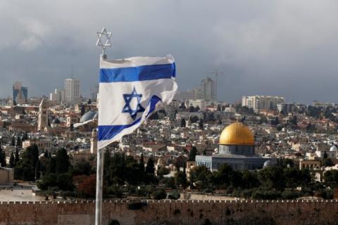 An Israeli flag is seen near the Dome of the Rock, located in Jerusalem's Old City on the compound known to Muslims as Noble Sanctuary and to Jews as Temple Mount, December 6, 2017. PHOTO BY REUTERS/Ammar Awad