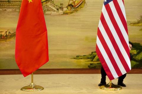 A U.S. flag is tweaked ahead of a news conference between U.S. Secretary of State John Kerry and Chinese Foreign Minister Wang Yi at the Ministry of Foreign Affairs in Beijing, Wednesday, Jan. 27, 2016. PHOTO BY REUTERS/Jacquelyn Martin
