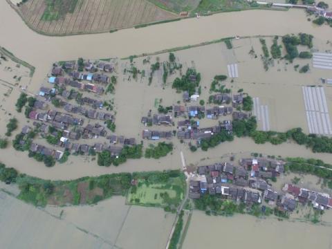 An aerial view shows that houses are flooded in villages in Wuxi, Jiangsu Province, China, July 4, 2016. PHOTO BY REUTERS/Stringer