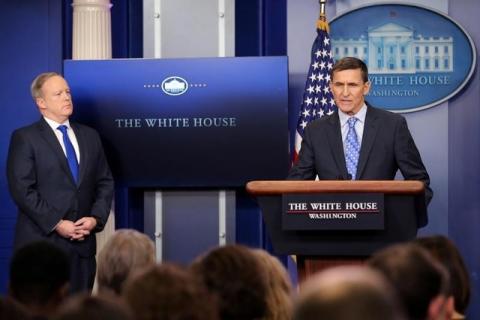 National security adviser General Michael Flynn (R) delivers a statement next to Press Secretary Sean Spicer during the daily briefing at the White House in Washington U.S., February 1, 2017. PHOTO BY REUTERS/Carlos Barri