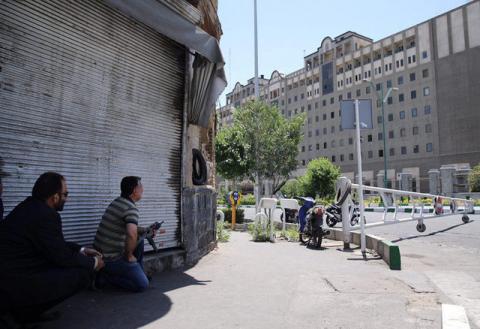 Members of Iranian forces take position during an attack on the Iranian parliament in central Tehran, Iran, June 7, 2017. PHOTO BY REUTERS/Omid Vahabzadeh/TIMA