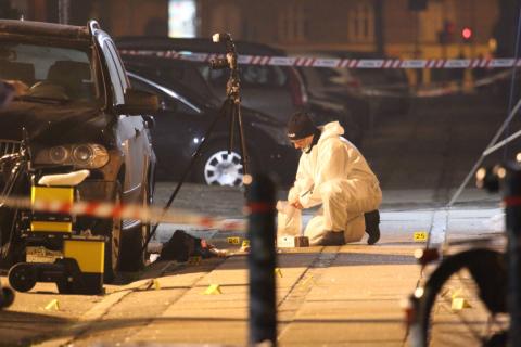 Forensic investigators are seen at the site of a shooting in Copenhagen, February 14, 2015. PHOTO BY REUTERS/Mathias Oegendal