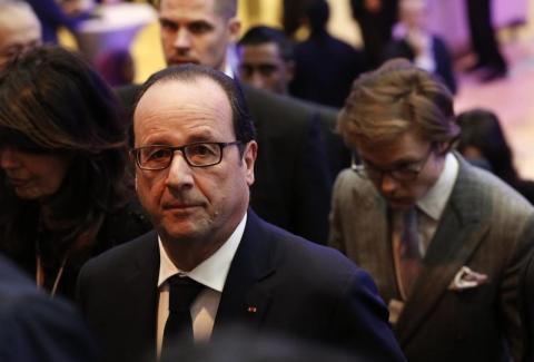 French President Francois Hollande arrives at the Congress Hall of the World Economic Forum venue in the Swiss mountain resort of Davos, January 23, 2015. PHOTO BY REUTERS/Ruben Sprich