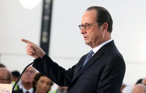 France's President Francois Hollande gestures as he speaks during a visit to Louvre Abu Dhabi, in Abu Dhabi, United Arab Emirates, December 3, 2016. PHOTO BY REUTERS/Stringer