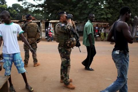 French peacekeeping soldiers patrol a street of the mostly muslim neighbourhood of PK 5 in Bangui, Central African Republic, November 25, 2015. PHOTO BY REUTERS/Siegfried Modola