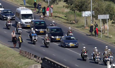 People pay their respects as the funeral cortege for Winnie Madikizela-Mandela arrives at Orlando stadium in Soweto, South Africa, April 14, 2018. PHOTO BY REUTERS/Mike Hutchings