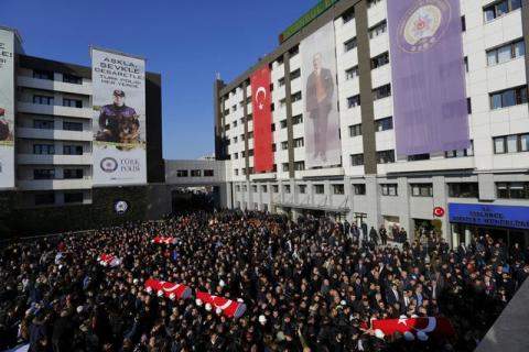 People carry the flag-draped coffins of police officers killed in Saturday's blasts in Istanbul, Turkey, December 11, 2016. PHOTO BY REUTERS/Murad Sezer