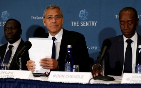 George Clooney (C), with fellow actor Don Cheadle (R) and The Sentry investigative journalist Brian Adeba (L), discuss The Sentry's investigation of the role of national corruption in the ongoing humanitarian crisis in South Sudan during a news conference at the National Press Club in Washington, U.S., September 12, 2016. PHOTO BY REUTERS/Jonathan Ernst