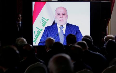 Iraqi Prime Minister Haider al-Abadi is seen on a screen as he speaks via a videoconference during a ministerial summit to hold discussion on the future of Mosul city, post-Islamic State, in Paris, France, October 20, 2016. PHOTO BY REUTERS/Regis Duvignau
