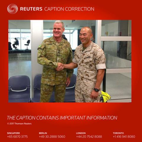 U.S. Marines commander Lieutenant Colonel Brian Middleton (R) shakes hands with Australian Army Brigadier Ken James after arriving for the sixth annual Marines' deployment at Darwin in northern Australia, April 18, 2017. PHOTO BY REUTERS/Tom Westbrook