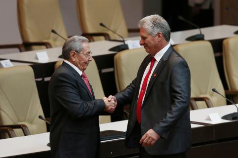Newly elected Cuban President Miguel Diaz-Canel (R) shakes hands with former Cuban President Raul Castro during the National Assembly in Havana, Cuba, April 19, 2018. PHOTO BY REUTERS/Alexandre Meneghini