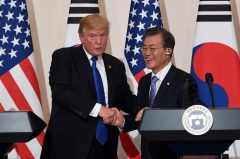 U.S. President Donald Trump and South Korea's President Moon Jae-in shake hands during a joint press conference at the presidential Blue House in Seoul, South Korea, November 7, 2017. PHOTO BY REUTERS/Jung Yeon-Je