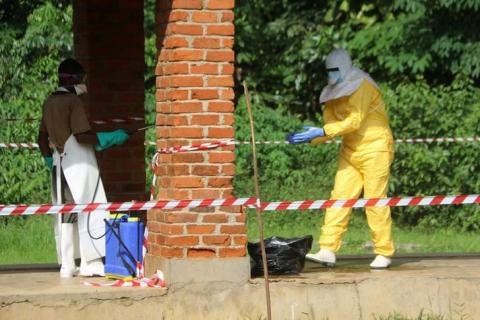 A health worker is sprayed with chlorine after visiting the isolation ward at Bikoro hospital, which received a new suspected Ebola case, in Bikoro, Democratic Republic of Congo, May 12, 2018. PHOTO BY REUTERS/Jean Robert N'Kengo