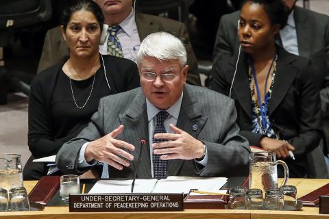 U.N. Head of the Department of Peacekeeping Operations Herve Ladsous (C) speaks to members of United Nations Security Council during a meeting on the Ebola crisis at the U.N. headquarters in New York