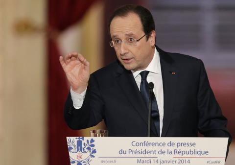 French President Francois Hollande answers a question during a news conference at the Elysee Palace in Paris