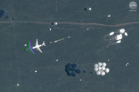 A satellite image shows an airborne paradrop in progress during the Russian military exercise known as Vostok 2018, conducted at the Tsugol training area in eastern Russia, September 13, 2018. PHOTO BY REUTERS/Satellite image ©2018 DigitalGlobe, a Maxar company