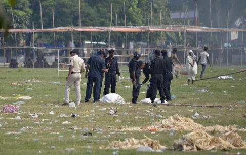 Indian National Security Guard (NSG) commandos inspect the site of a bomb blast in the eastern Indian city of Patna