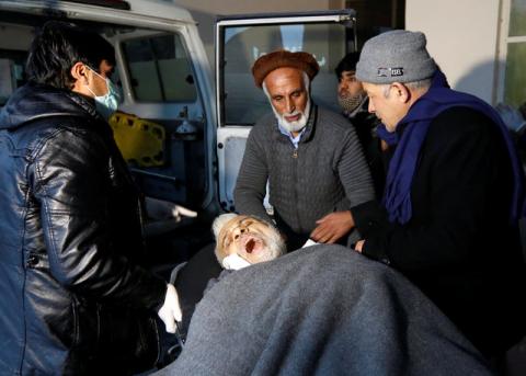 Men carry an injured man to a hospital after a bomb blast in Kabul, Afghanistan, February 7, 2017. PHOTO BY REUTERS/Mohammad Ismail