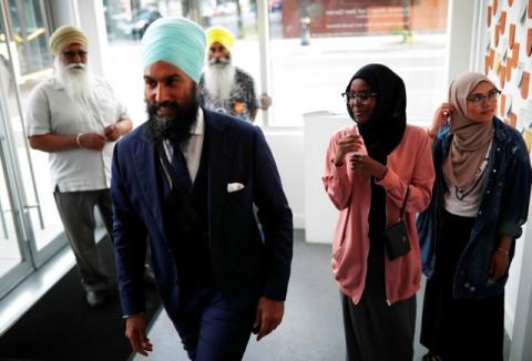 New Democratic Party federal leadership candidate Jagmeet Singh walks through the room at a meet and greet event in Hamilton, Ontario, Canada, July 17, 2017. PHOTO BY REUTERS/Mark Blinch
