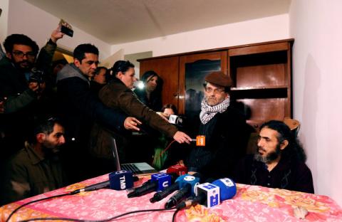 Former Guantanamo detainee Jihad Diyab (R) from Syria answers media questions during a news conference, while on a hunger strike, in Montevideo, Uruguay, September 30, 2016. PHOTO BY REUTERS/Andres Stapff