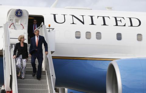 U.S. Secretary of State John Kerry steps off his aircraft alongside Australia's Foreign Minister Julie Bishop (L) in Sydney
