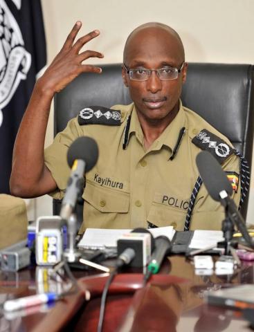 Uganda's former Inspector General of Police Kale Kayihura gestures during a presentation to the media, of reconstructed images of suspected Al Shabab suicide bombers involved in last week's bomb attacks, in Uganda's capital Kampala, July 18, 2010. PHOTO BY REUTERS/James Akena