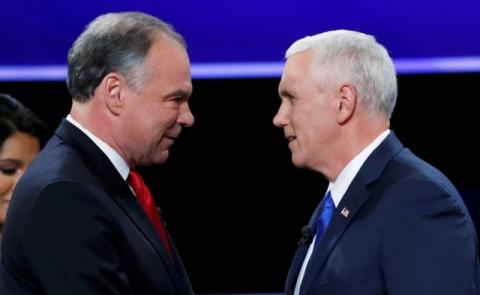 Democratic U.S. vice presidential nominee Senator Tim Kaine (L) and Republican U.S. vice presidential nominee Governor Mike Pence shake hands as they arrive for their vice presidential debate at Longwood University in Farmville, Virginia, U.S., October 4, 2016. PHOTO BY REUTERS/Kevin Lamarque