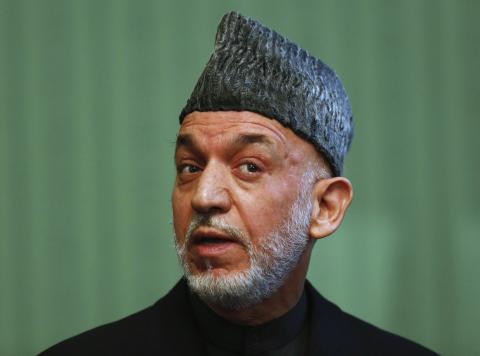 Afghan President Hamid Karzai speaks during a news conference in Kabul