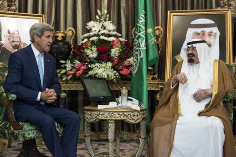Saudi King Abdullah bin Abdul Aziz al-Saud (R) talks with U.S. Secretary of State John Kerry before a meeting at the Royal Palace in Jeddah, September 11, 2014. PHOTO BY REUTERS/Brendan Smialowski
