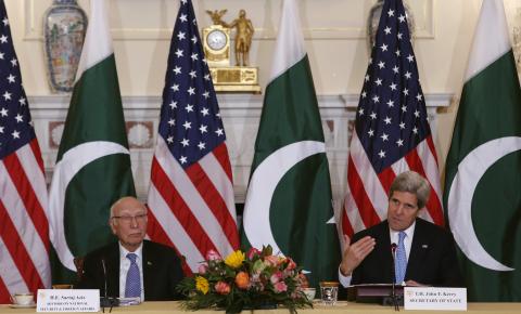 U.S. Secretary of State John Kerry (R) and Pakistan's National Security and Foreign Affairs Advisor Sartaj Aziz deliver opening remarks at a ministerial-level meeting at the State Department in Washington