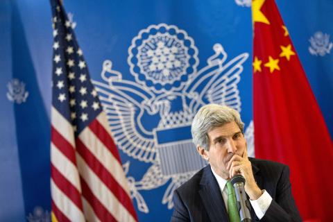 U.S. Secretary of State John Kerry listens to a question during a discussion with Chinese bloggers in Beijing