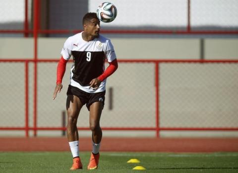 Ghana's Kevin-Prince Boateng heads a ball during a training session ahead of their 2014 World Cup against Portugal, in Brasilia