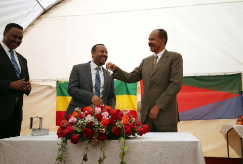 Eritrea's President, Isaias Afwerki receives a key from Ethiopia's Prime Minister, Abiy Ahmed during the Inauguration ceremony marking the reopening of the Eritrean Embassy in Addis Ababa, Ethiopia, July 16, 2018. PHOTO BY REUTERS/Tiksa Negeri